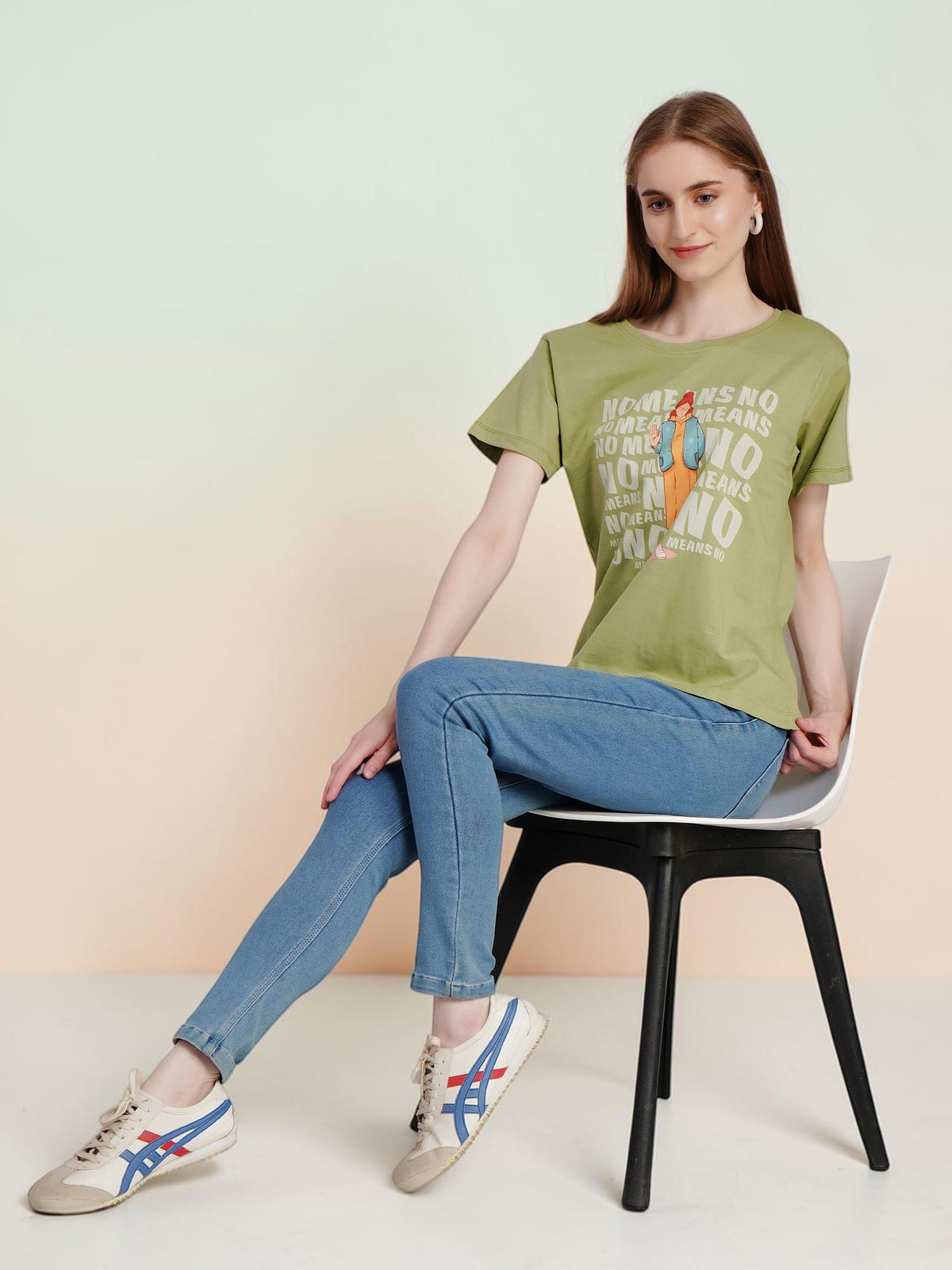 Model wearing an enaay.com olive green cotton t-shirt with No Means No graphic print, paired with blue jeans