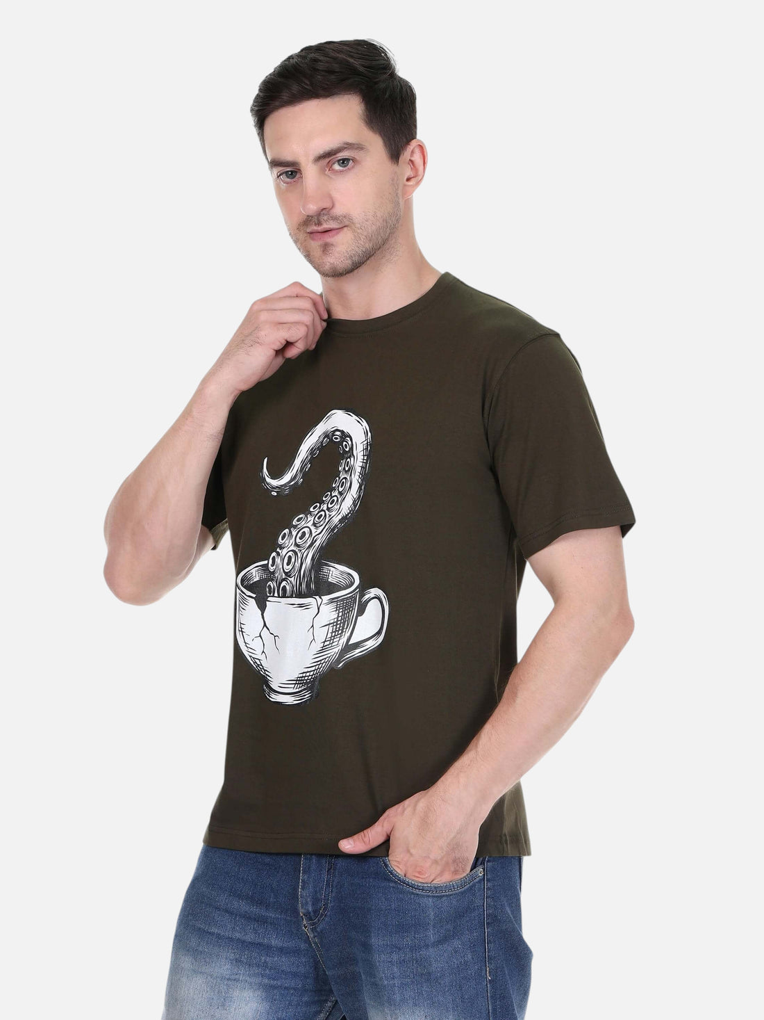Model wearing an enaay.com olive green cotton t-shirt with a surreal octopus tentacle and coffee cup graphic print