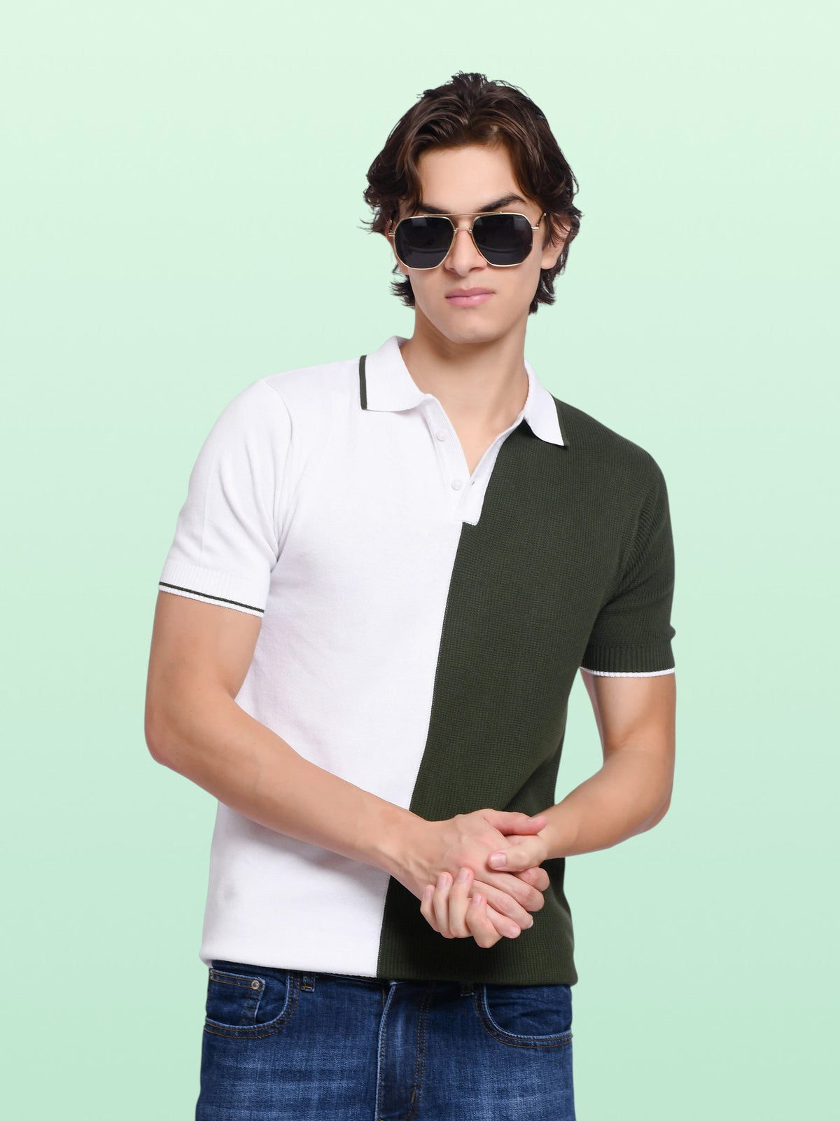 A man wearing an enaay.com olive green and white colour-block knitted polo shirt with a classic collar and sunglasses.