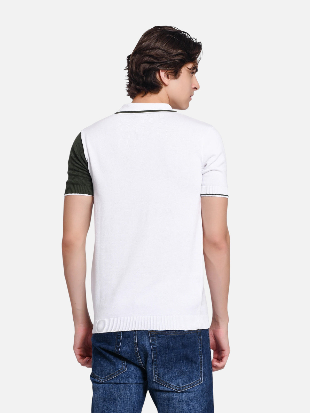 Back view of a man wearing an enaay.com olive green and white colour-block knitted polo shirt with ribbed cuffs.