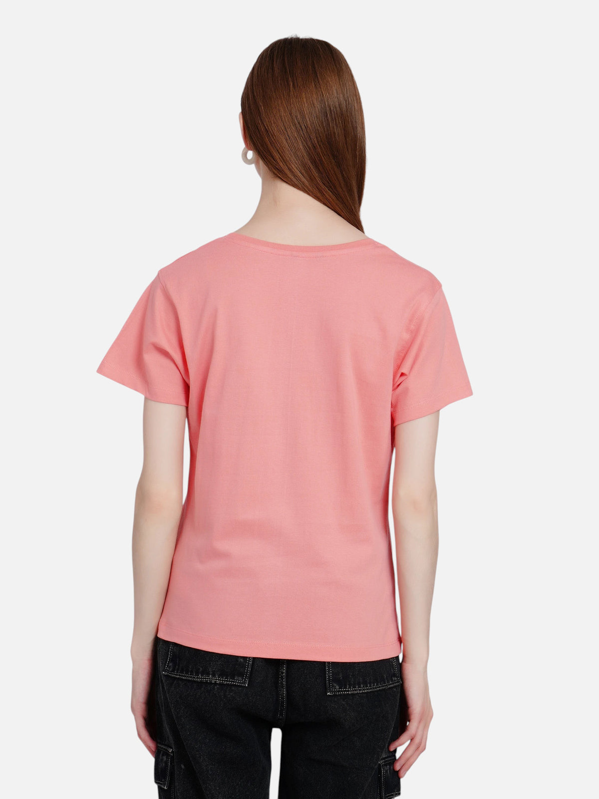 Back view of a woman wearing an enaay.com peach pink round neck cotton t-shirt with plain back