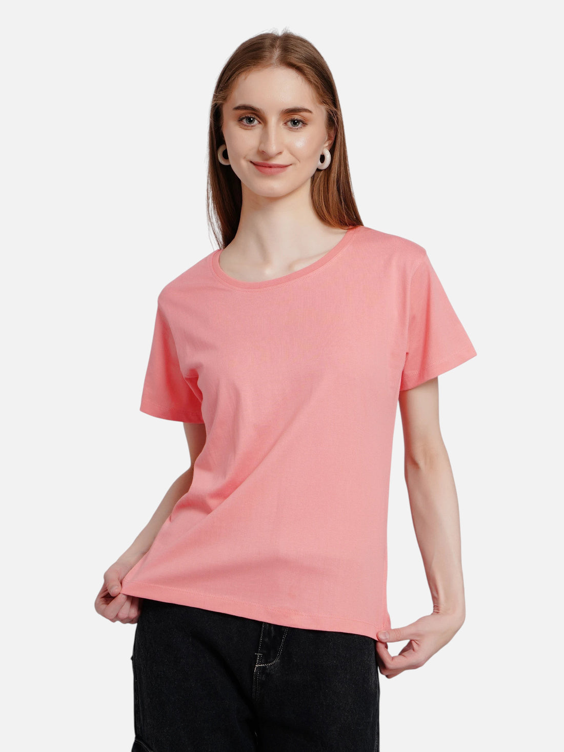 Model wearing an enaay.com peach pink round neck cotton t-shirt with short sleeves and a regular fit.