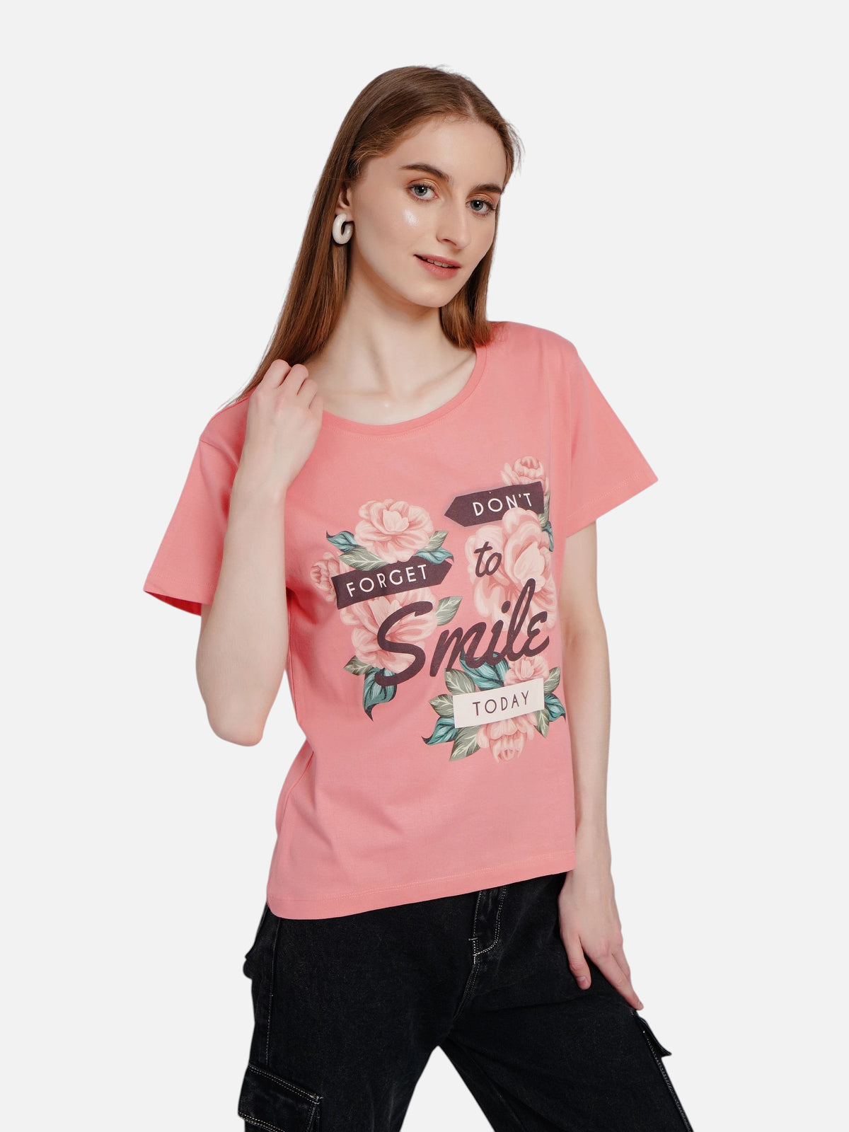 Model wearing an enaay.com pink cotton crew neck t-shirt with floral graphic and Don't Forget To Smile Today text