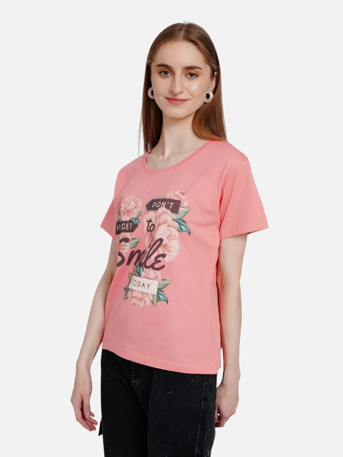 Model wearing an enaay.com pink cotton crew neck t-shirt with a floral Don't Forget To Smile Today graphic print.