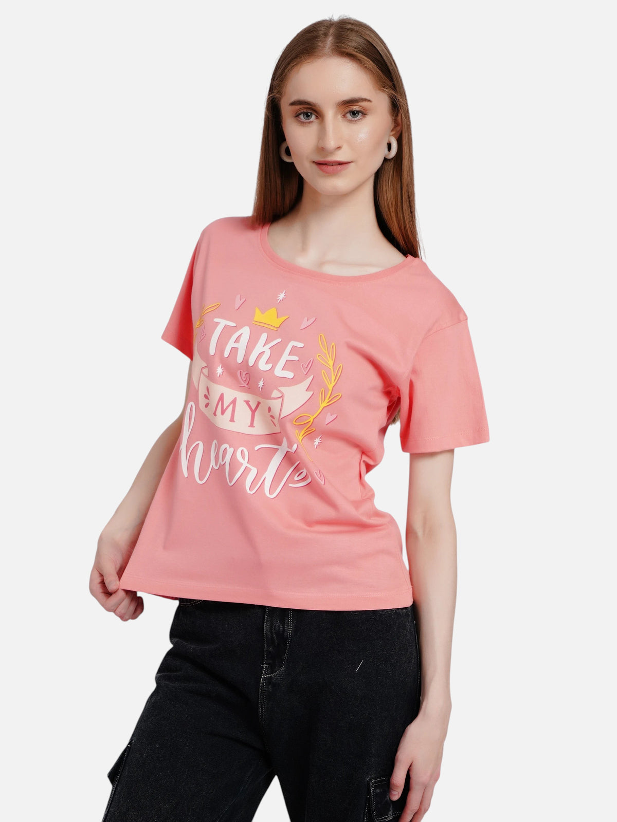 Model wearing an enaay.com coral pink cotton t-shirt with Take My Heart graphic print, round neck, and short sleeves.