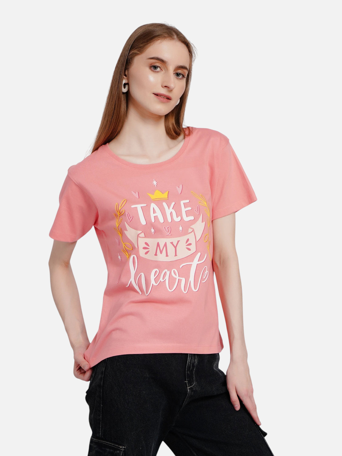 Model wearing an enaay.com coral pink cotton round neck t-shirt with a Take My Heart graphic print.