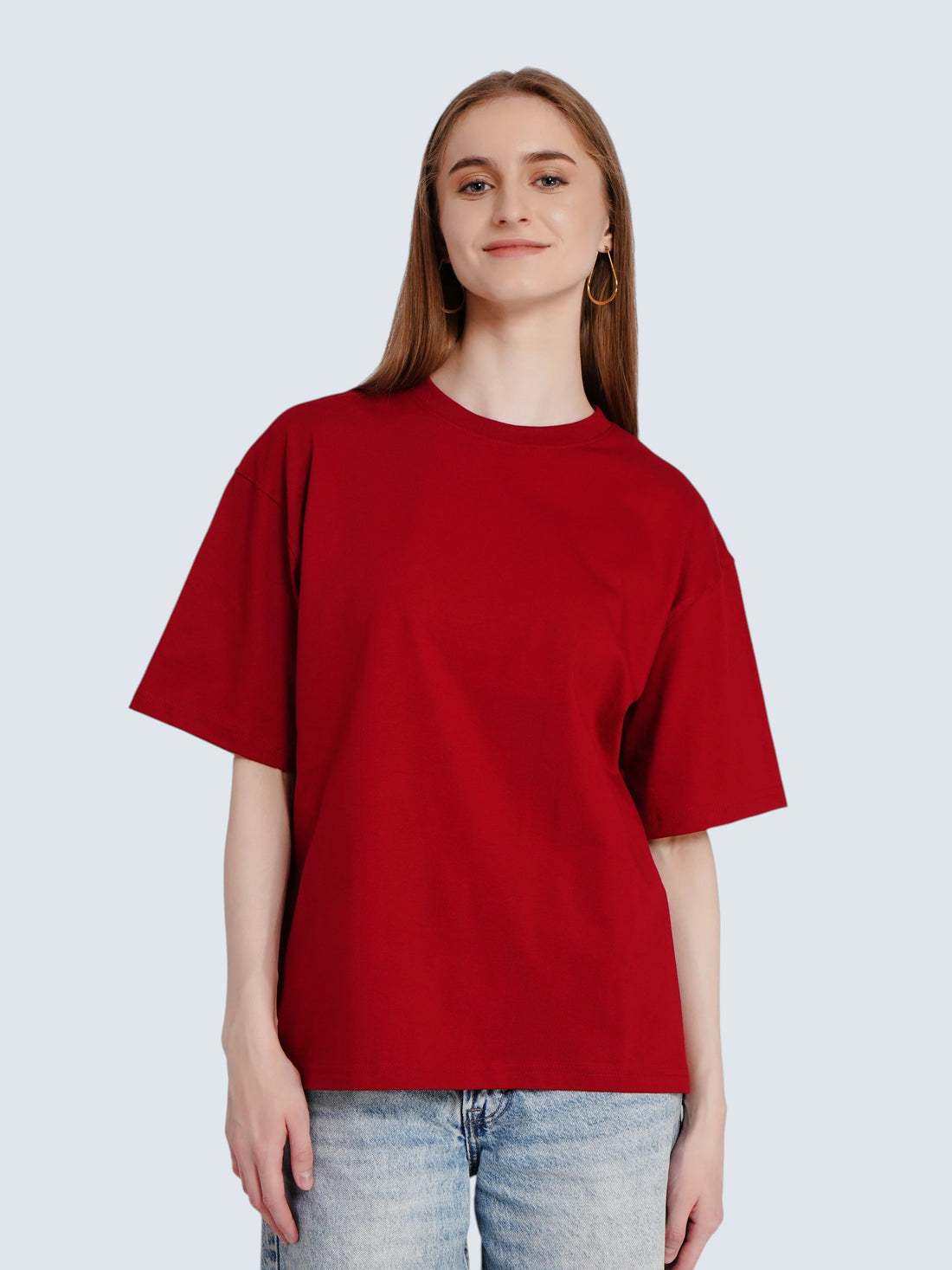 Model wearing an enaay.com red oversized premium cotton t-shirt with a solid design and relaxed fit