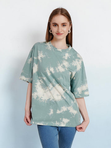 Model wearing an enaay.com sage green and off-white cloud tie-dye oversized cotton t-shirt with drop shoulders.