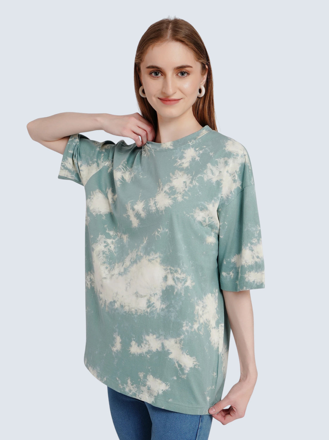 Model wearing an enaay.com sage green and off-white cloud tie-dye oversized cotton t-shirt with drop shoulders.