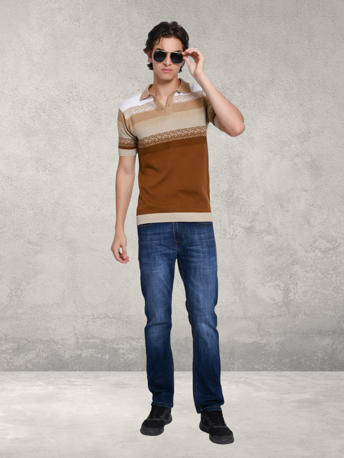 enaay.com men's striped knit polo shirt in brown, beige, and white with short sleeves, worn with blue jeans and shades