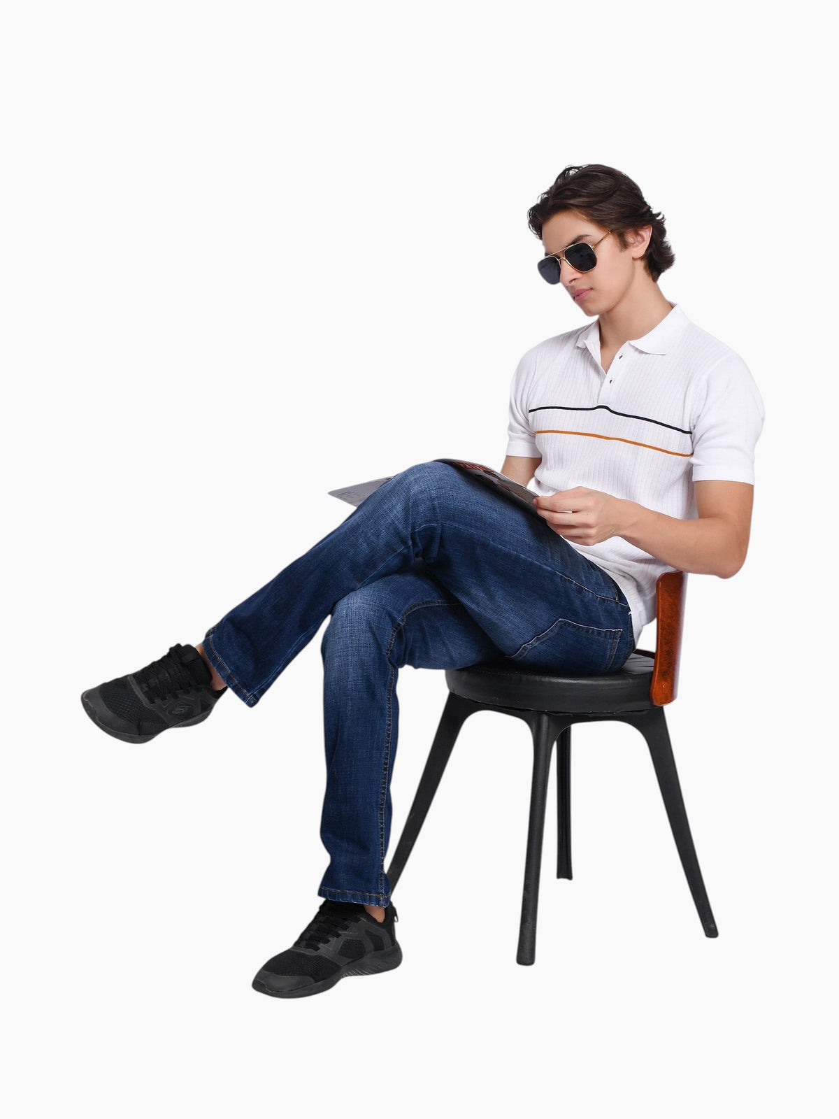 Model wearing an enaay.com white knit polo shirt with black and orange chest stripes, blue jeans, and sunglasses.