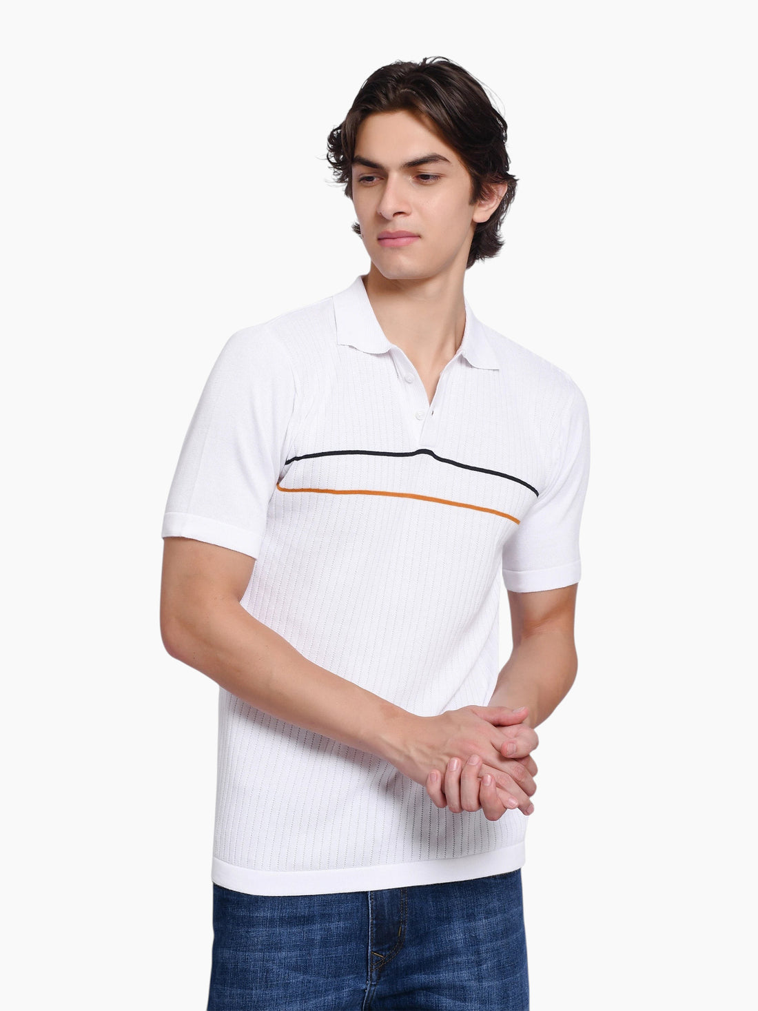 Model wearing an enaay.com white knit polo shirt with black and orange chest stripes and a classic button placket