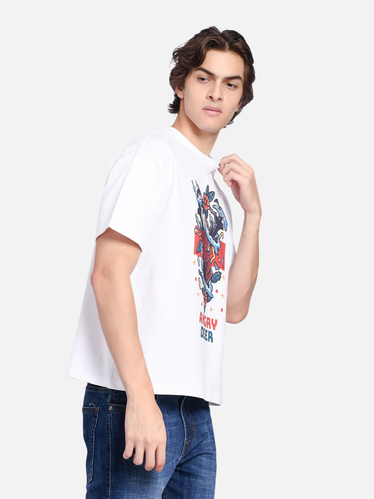 Model wearing an enaay.com white oversized t-shirt with a vibrant angry deer graphic print and crew neck