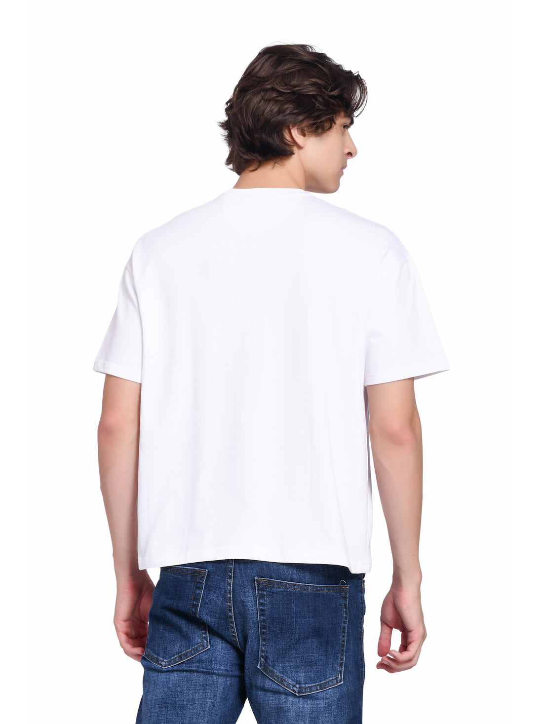 A man wearing a plain white crew neck t-shirt from enaay.com, viewed from the back with blue denim jeans.